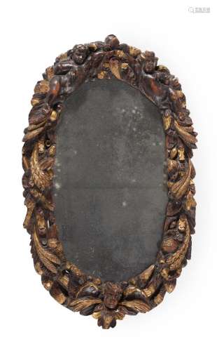 A CARVED WALNUT AND PARCEL GILT WALL MIRROR, EARLY 18TH CENT...