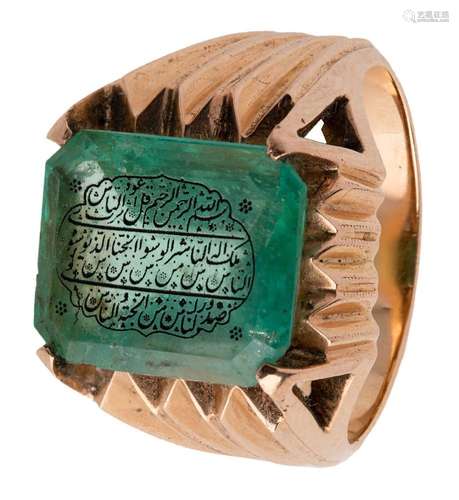 An inscribed emerald set into a gold ring