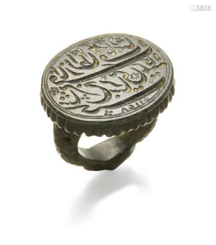 A Mughal nephrite inscribed seal ring dated 1148 AH/1736AD a...