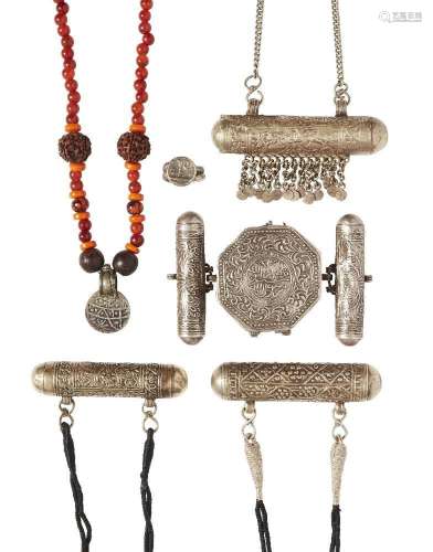 A group of silver talismanic pendants