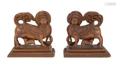 Two carved wood figures of Kamadhenu