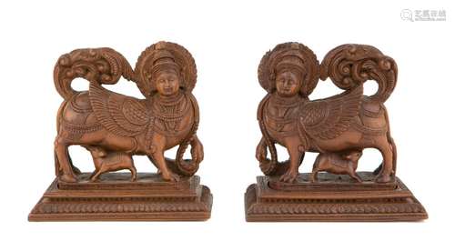 Two carved wood figures of Kamadhenu