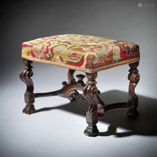 A CHARLES I CARVED WALNUT STOOL, SECOND QUARTER 17TH CENTURY