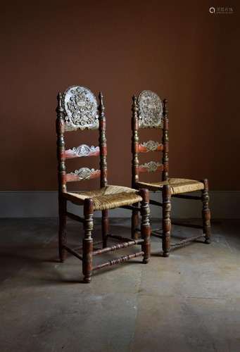 A MATCHED PAIR OF CONTINENTAL RED PAINTED AND SILVERED CHAIR...