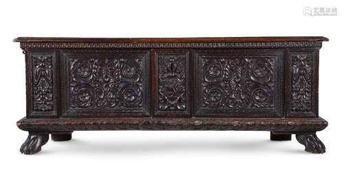 AN ITALIAN CARVED WALNUT CASSONE, CIRCA 1600