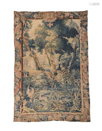 A FLEMISH ARMORIAL SURMOUNTED VERDURE TAPESTRY PANEL, LATE 1...