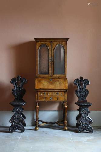 A QUEEN ANNE WALNUT AND FEATHER BANDED BUREAU CABINET, CIRCA...