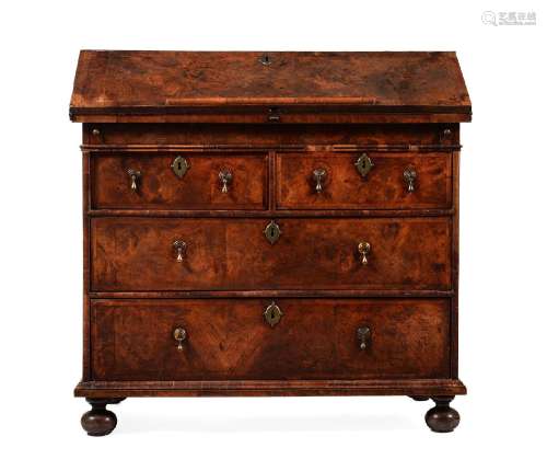 A QUEEN ANNE WALNUT AND FEATHER BANDED BUREAU, CIRCA 1705