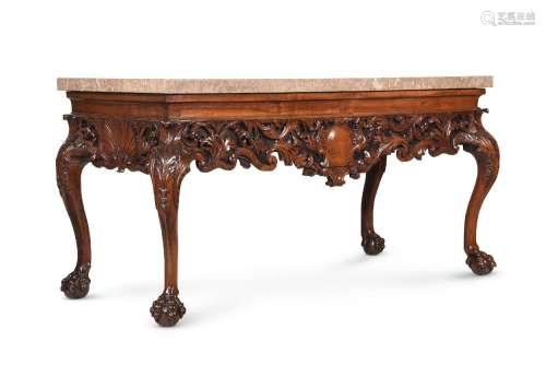 A CARVED WALNUT AND MARBLE MOUNTED CONSOLE TABLE, IN IRISH G...