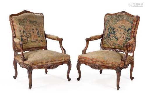 A PAIR OF FRENCH WALNUT AND NEEDLEWORK UPHOLSTERED FAUTEUILS...
