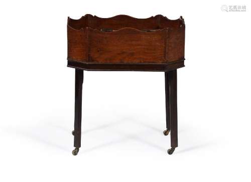A GEORGE III MAHOGANY OCTAGONAL BOTTLE STAND OR JARDINIERE, ...