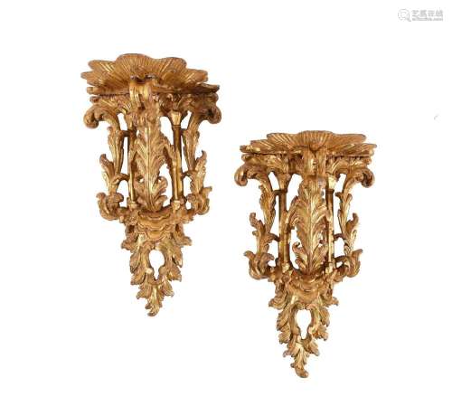A PAIR OF CARVED GILTWOOD WALL BRACKETS, ONE GEORGE III, THE...