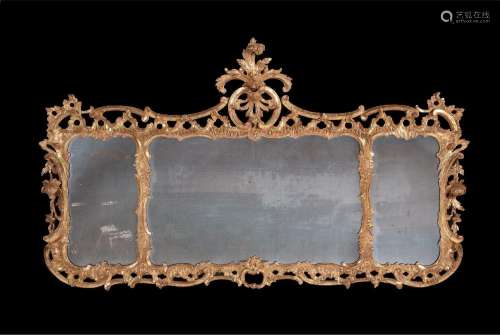 A GEORGE III CARVED GILTWOOD MIRROR, IN THE ROCCOCO MANNER, ...