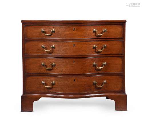 A GEORGE III MAHOGANY SERPENTINE FRONTED COMMODE IN THE MANN...