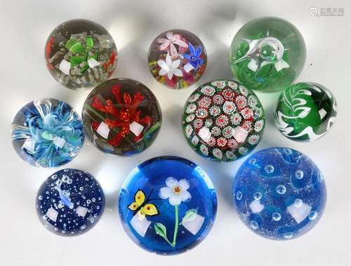 A collection of mostly Chinese glass paperweights, 20th cent...