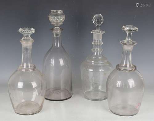 Two magnum-size glass decanters, 19th century, the clear tap...