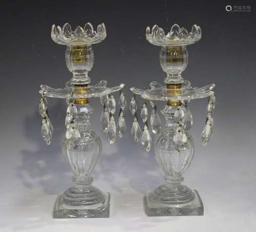 A pair of clear cut glass lustres, 19th century, the baluste...