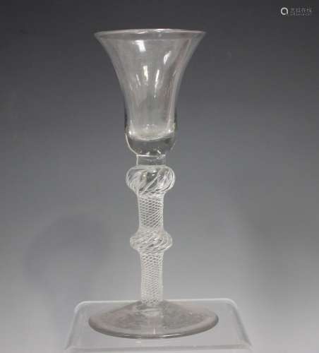 An airtwist stem wine glass, circa 1750, the bell bowl raise...