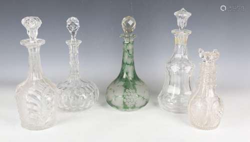 A segmented four-compartment cut glass decanter and stoppers...