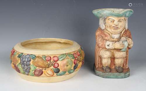 A Compton pottery bowl, the sides moulded with fruit, impres...