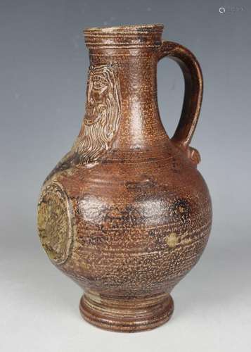 A stoneware Bellarmine jug, probably Rhenish, 17th century, ...