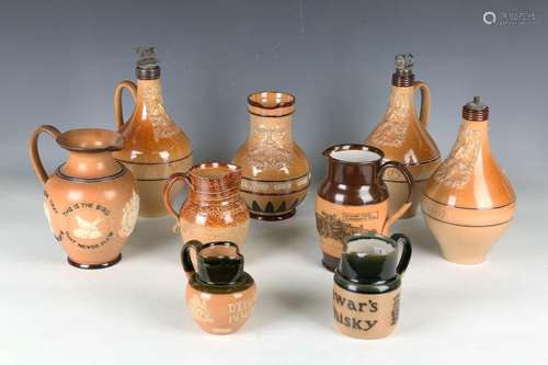 A collection of Doulton stoneware jugs, decanters and advert...