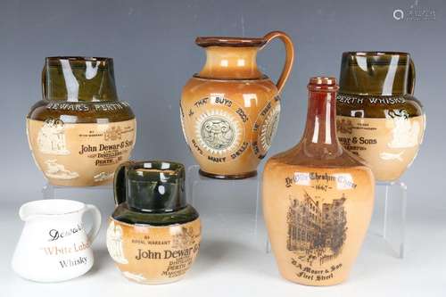 A collection of mostly stoneware 20th century advertising wa...