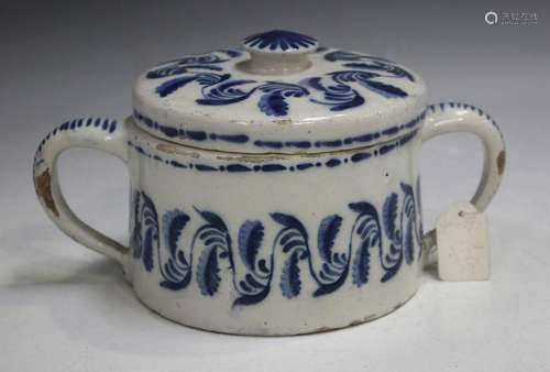 A Dutch Delft two-handled posset pot and cover, 18th century...