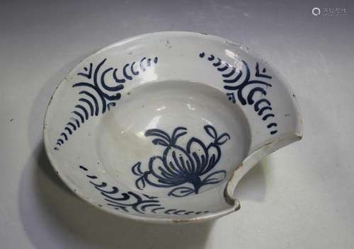 A Dutch Delft barber's bowl, 18th century, painted in blue w...