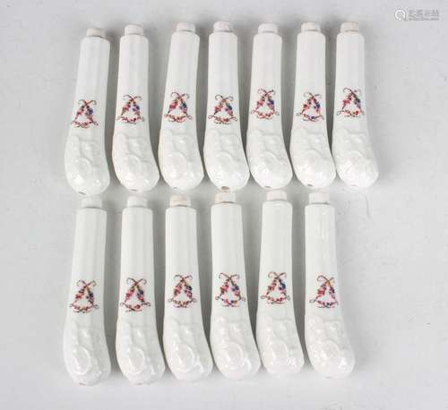 A set of thirteen pistol shaped porcelain knife hafts, late ...