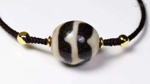 A ROUND DZI BEAD