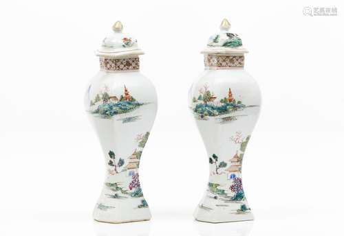 A pair of vases with covers