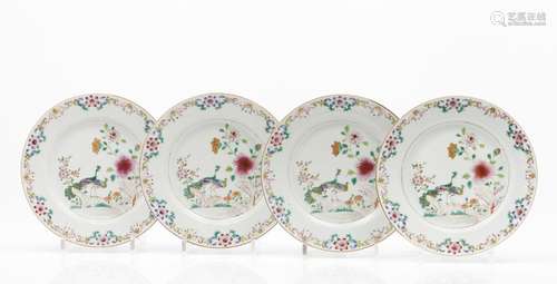 A set of four plates