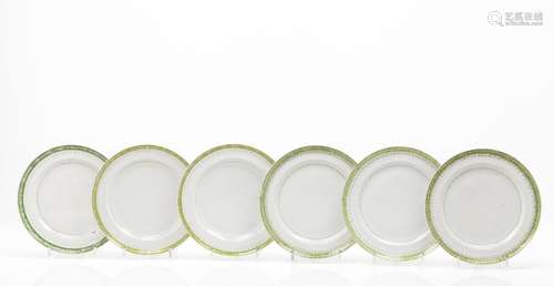 A set of six dinner plates