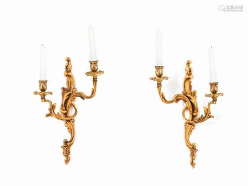 A pair of two branch wall sconces