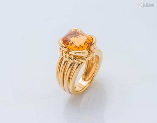 Bague en or jaune 18 carats (750 ‰) ornée d’une citrine cous...