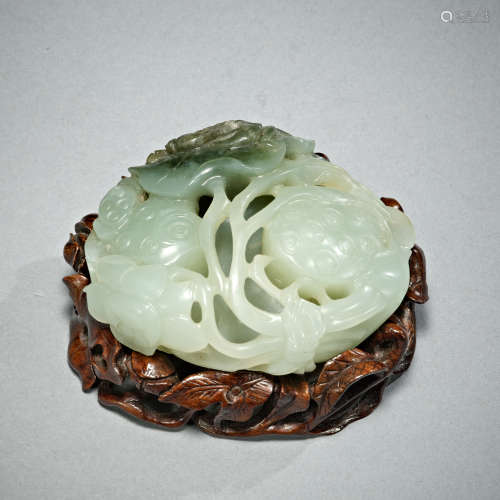 A jade carving of a lotus-pod and crab on a wood stand ,Qing...