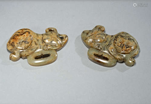 A pair of jade 'tiger' belt buckles ,Liao dynasty