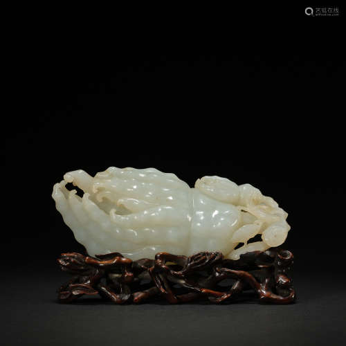 A white jade carving of a buddha hand citron, Qing dynasty
