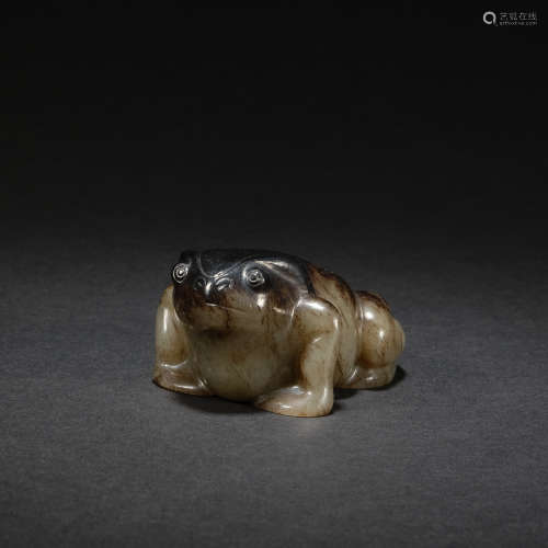 A gray and celadon jade 'frog' , Zhou dynasty