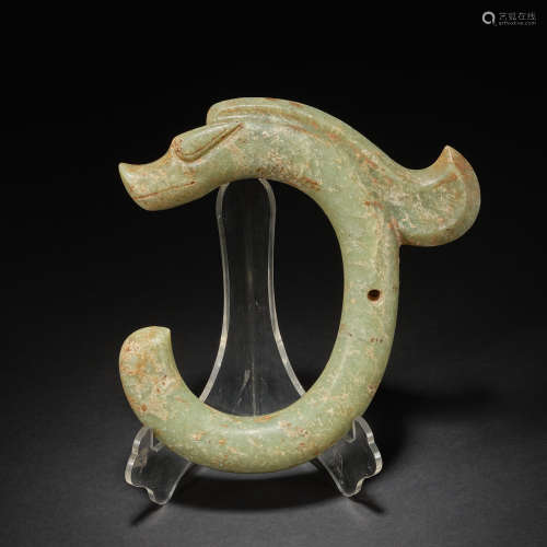 An important celadon jade ‘C-shaped' 'dragon' pendant Neolit...