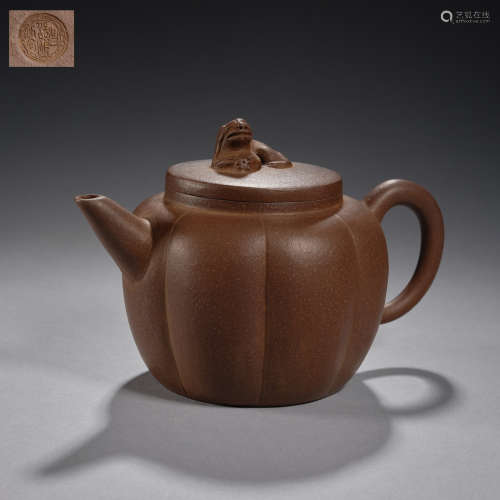 A Yixing 'lion button ' teapot and cover Qing dynasty