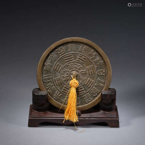 An Eight Diagrams bronze mirror with wood stand,Qing dynasty