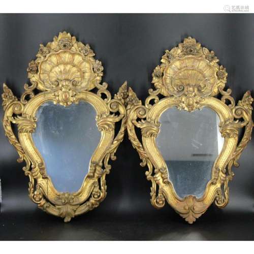 An Antique Pair Of Carved & Giltwood Mirrors