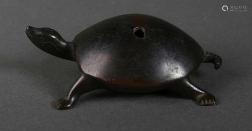 A turtle shaped copper incense stick holder