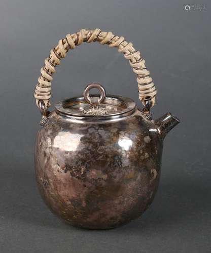 An exquisite silver pot