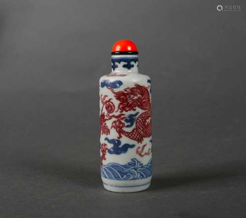 A blue and white underglaze red dragon porcelain snuff bottl...