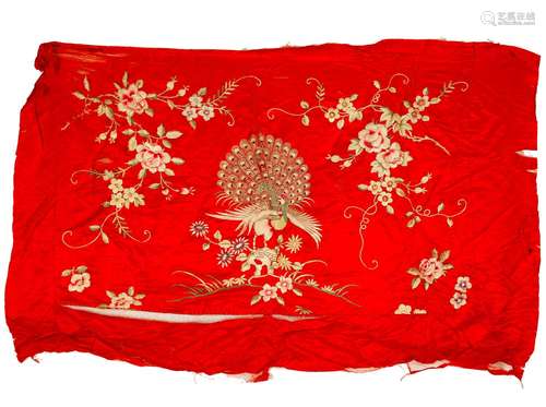 A piece of Chinese silk is embroidered with flowers and bird...