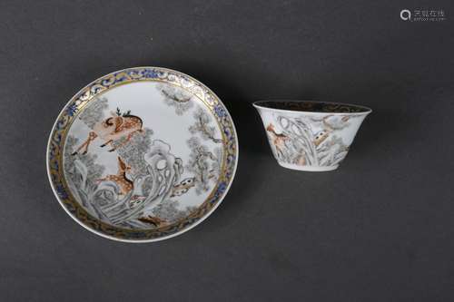 A set of ink colored pine and deer patterned porcelain cup a...