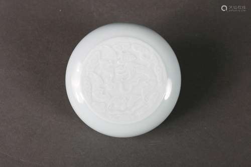 A bat and peach patterned white glazed porcelain box